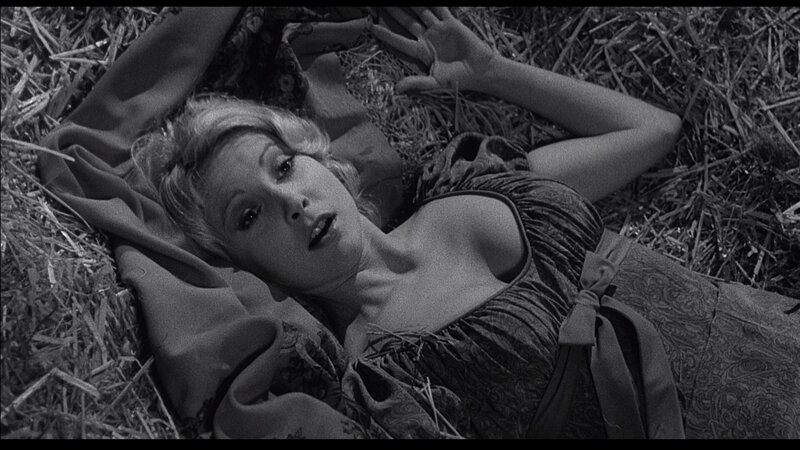 woman lying in hay
