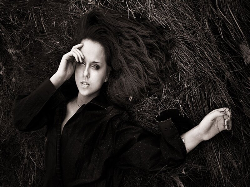 Woman Lying in Hay — Black, Dramatic