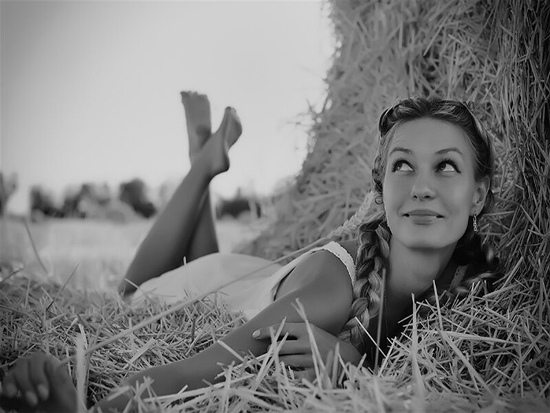 Woman Lying in Hay — Black, Serene