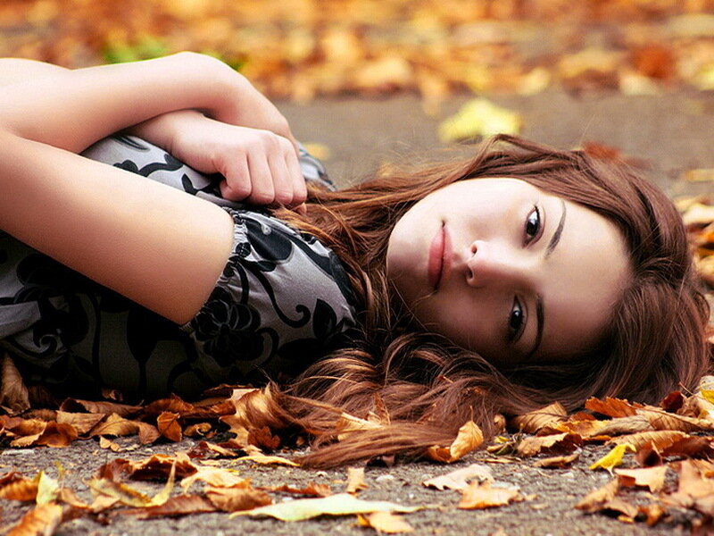 Woman Lying in Leaves — Brown, Calm