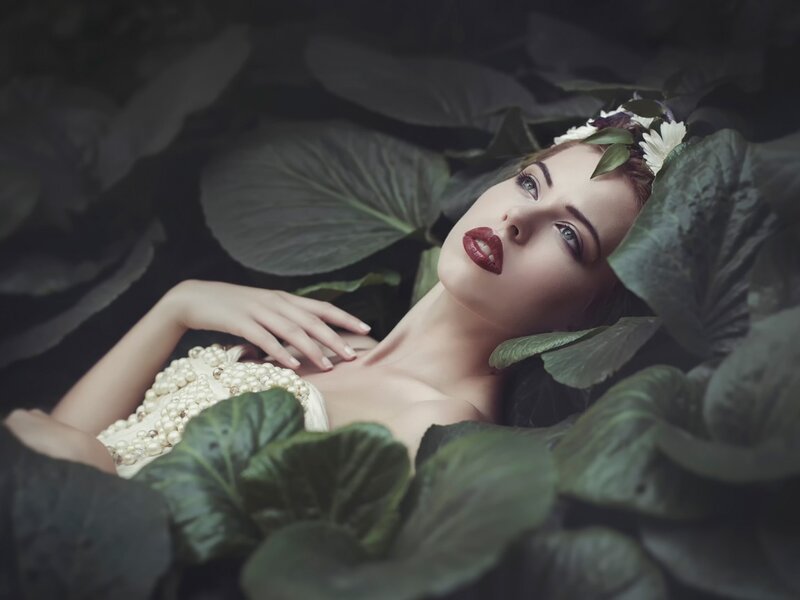 Woman Lying in Leaves — Green, Dramatic