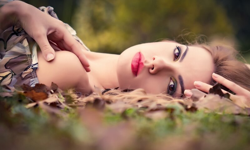 Woman Lying in Leaves — Green, Serene, Autumn