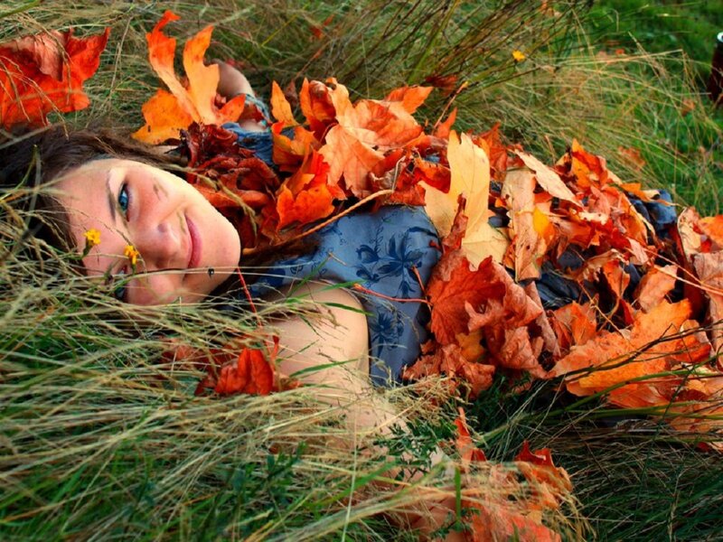 Woman Lying in Leaves — Orange, Peaceful