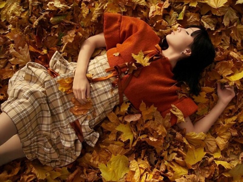 Woman Lying in Leaves — Orange, Serene