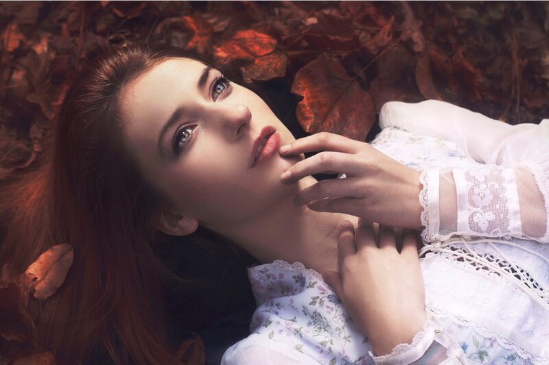 Woman Lying in Leaves — White, Serene, Autumn, Photograph
