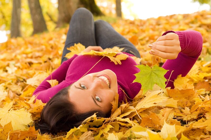 Woman Lying in Leaves — Yellow, Peaceful, Autumn