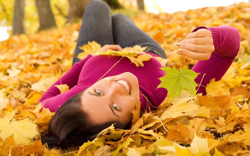 Woman Lying in Leaves — Yellow, Peaceful