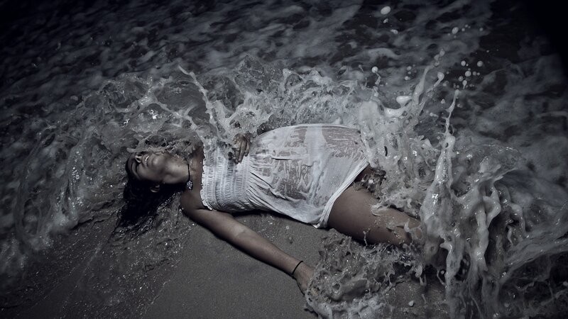 Woman Lying in Ocean