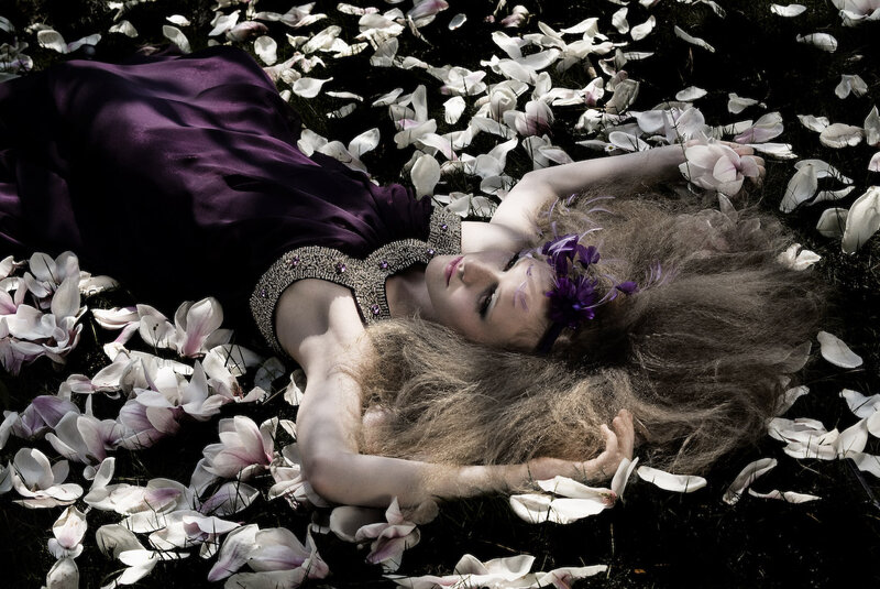 Woman Lying in Petals — Purple