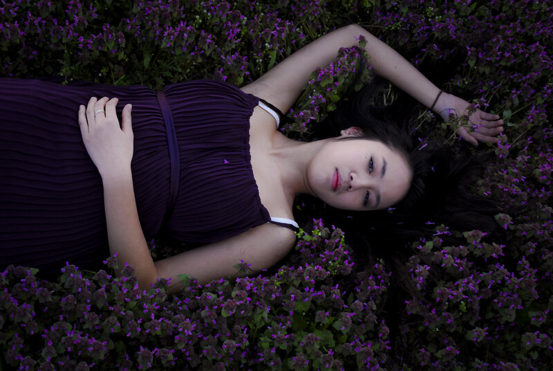 Woman lying in purple flowers