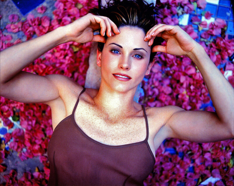 woman lying in rose petals