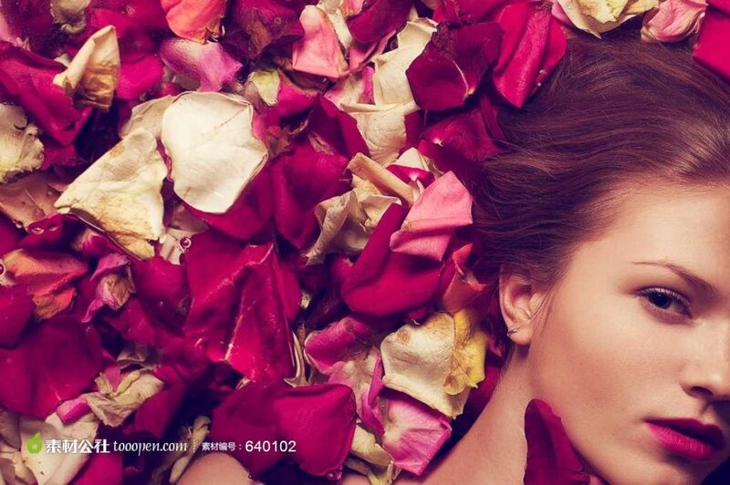 Woman Lying in Rose Petals — Red, Serene