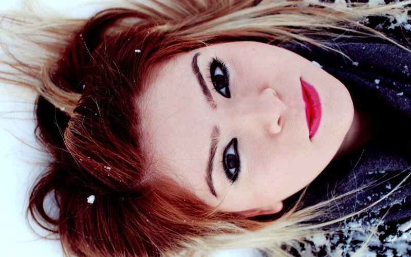 woman lying in snow