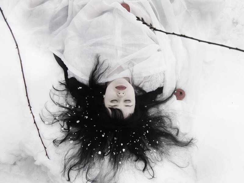 Woman Lying in Snow — White, Dramatic, Winter