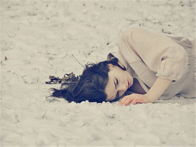 Woman Lying in Snow — White, Serene, Winter