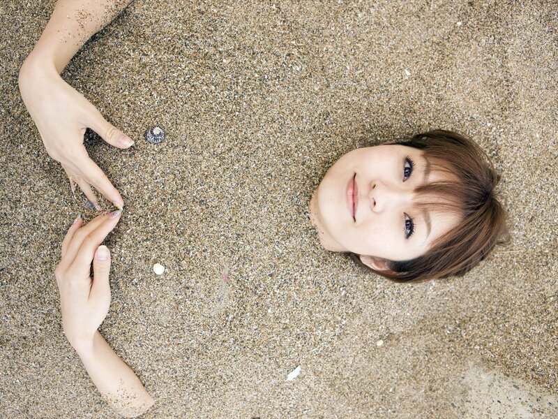 woman lying in the sand