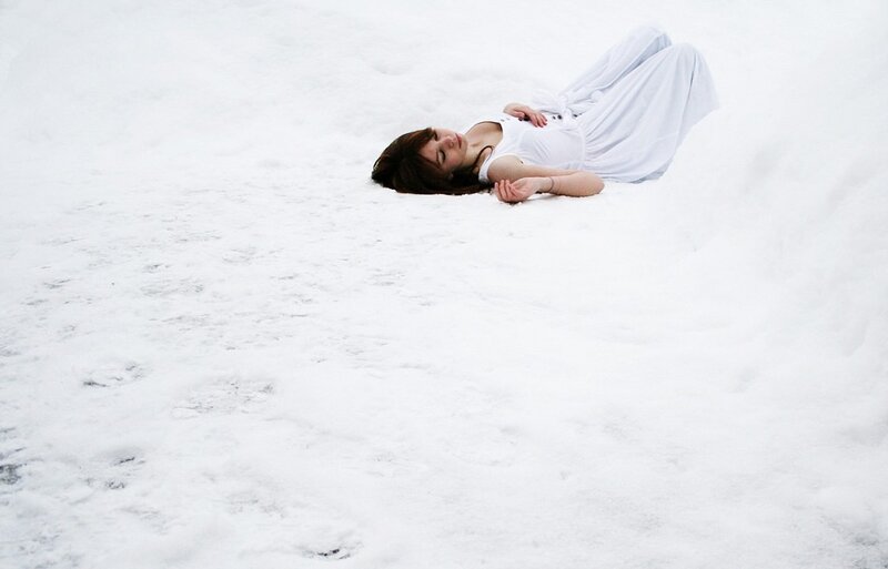 Woman lying in the snow