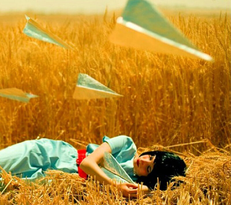 Woman Lying in Wheat Field