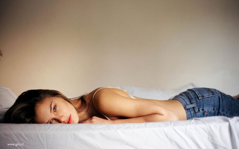 woman lying on a bed
