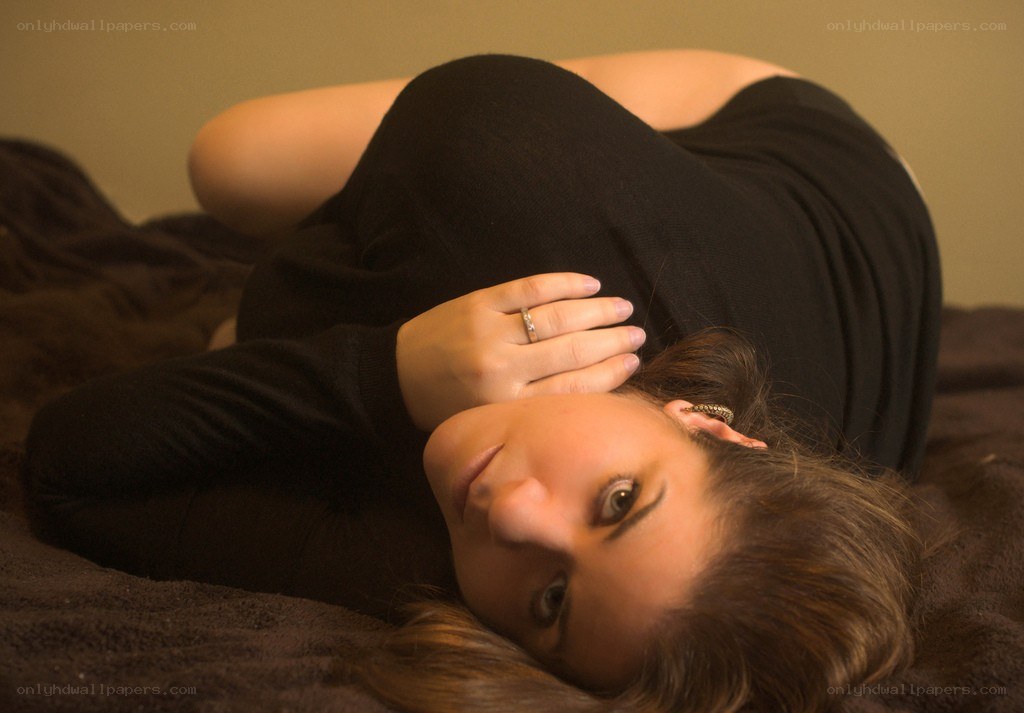 woman lying on a bed