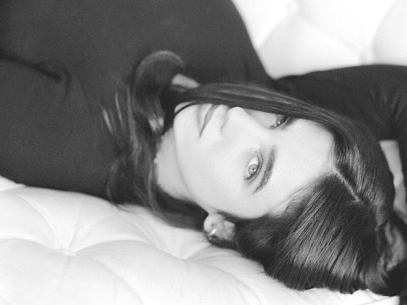 woman lying on a bed
