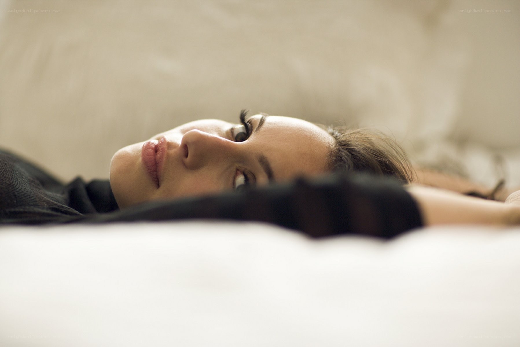 woman lying on a bed
