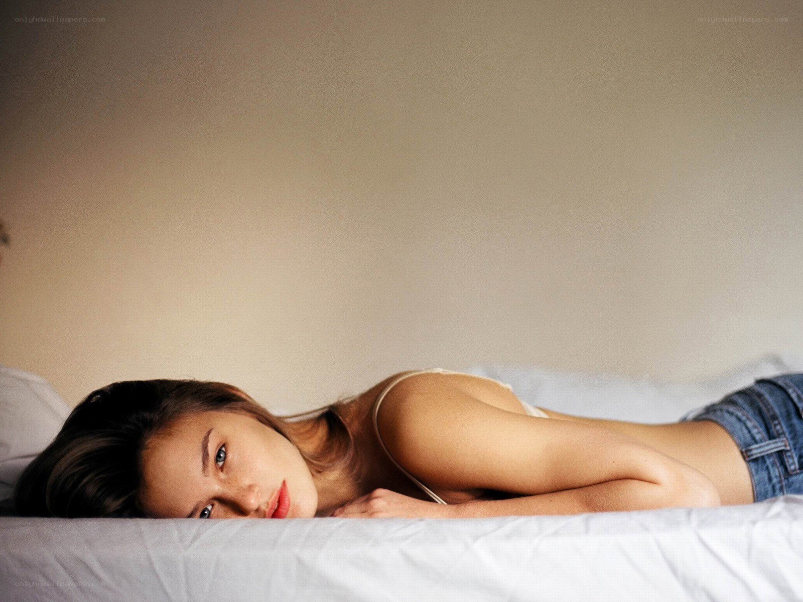 woman lying on a bed