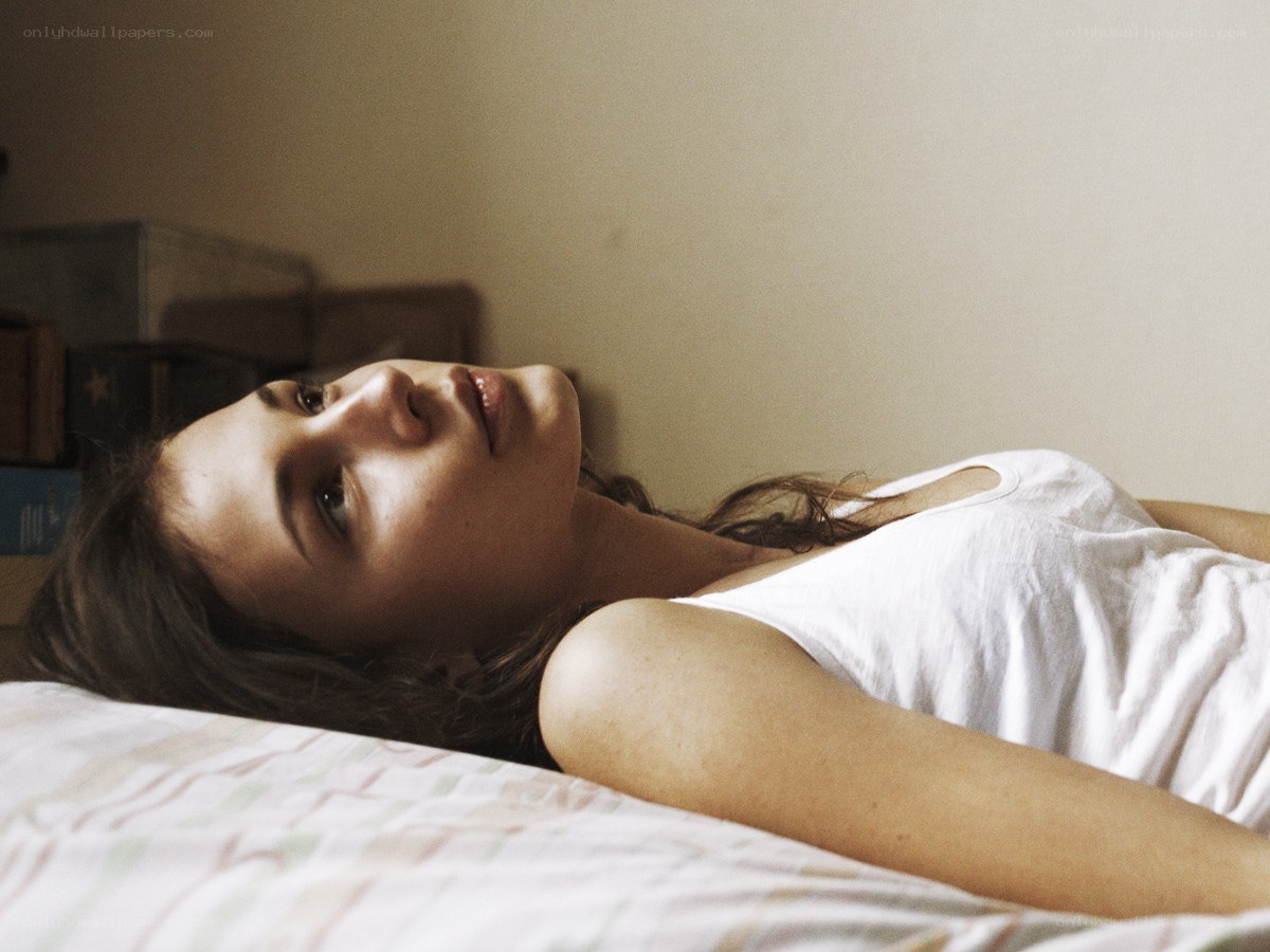 woman lying on a bed