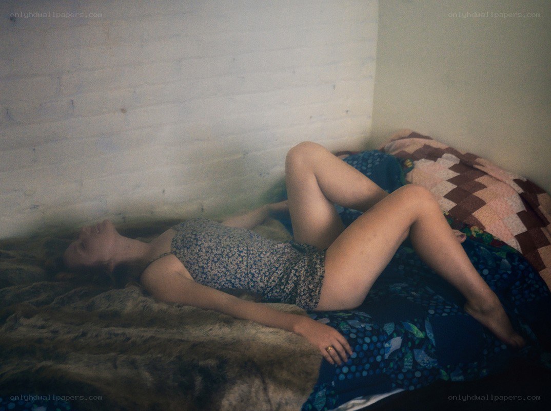 Woman lying on a bed