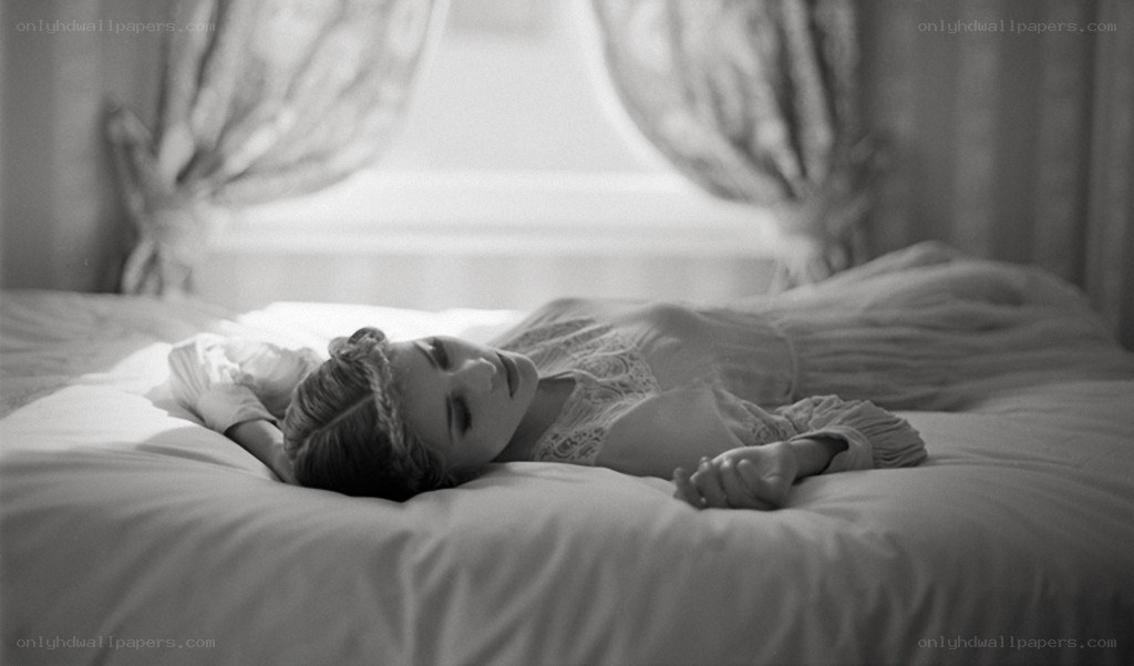 woman lying on a bed