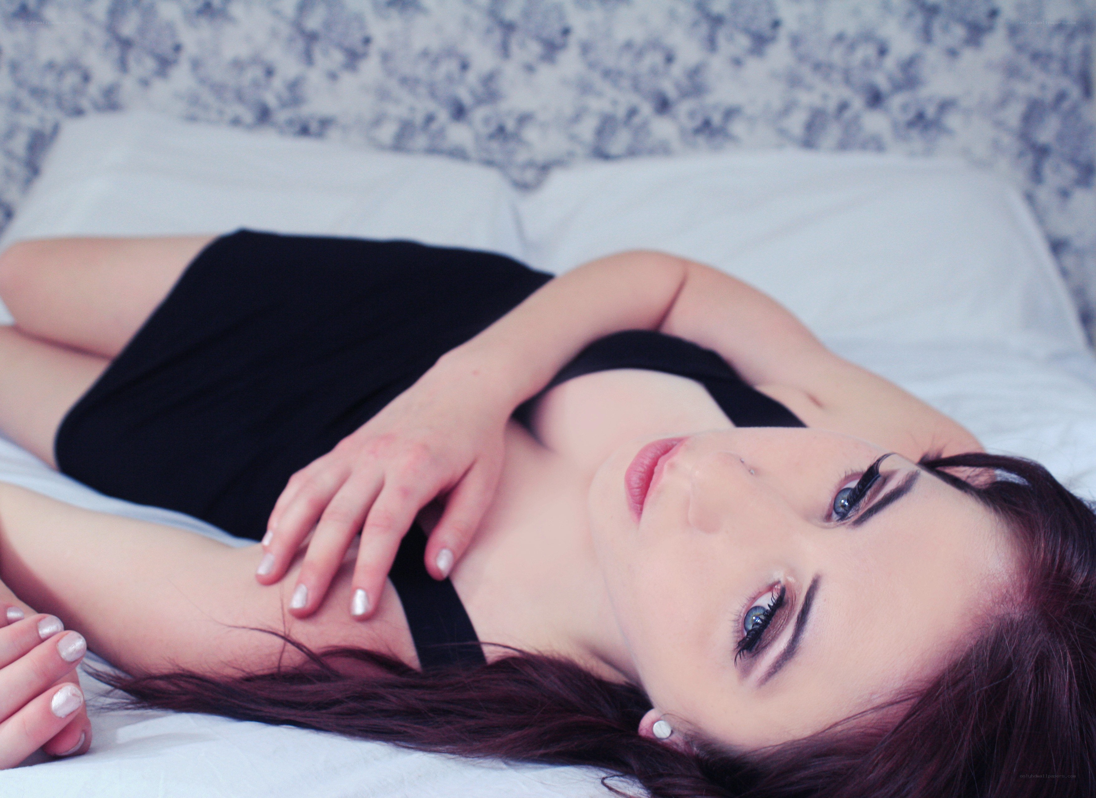 woman lying on a bed