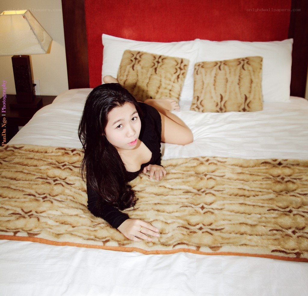 woman lying on a bed