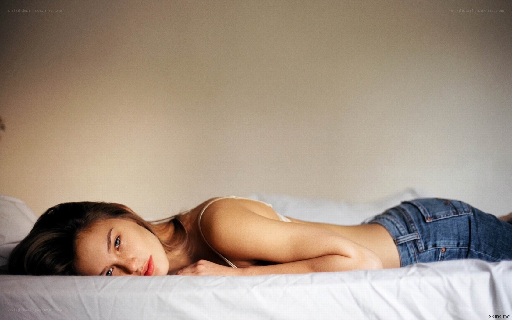 woman lying on a bed