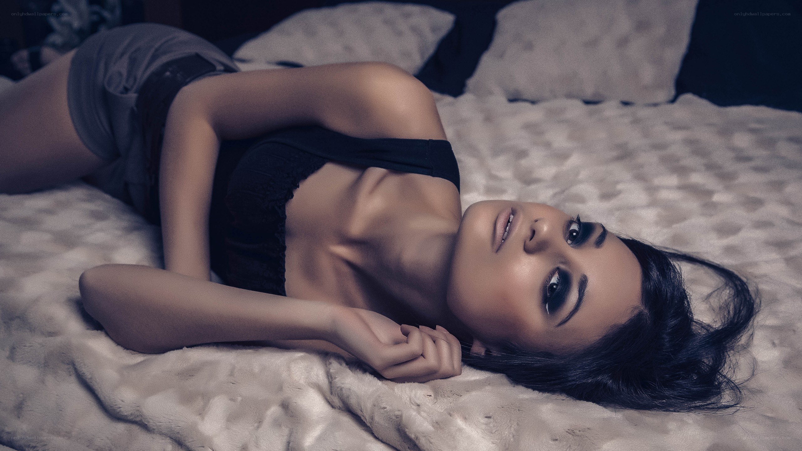 woman lying on a bed
