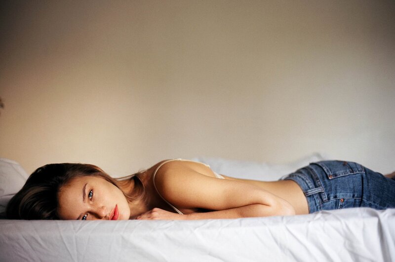 woman lying on a bed