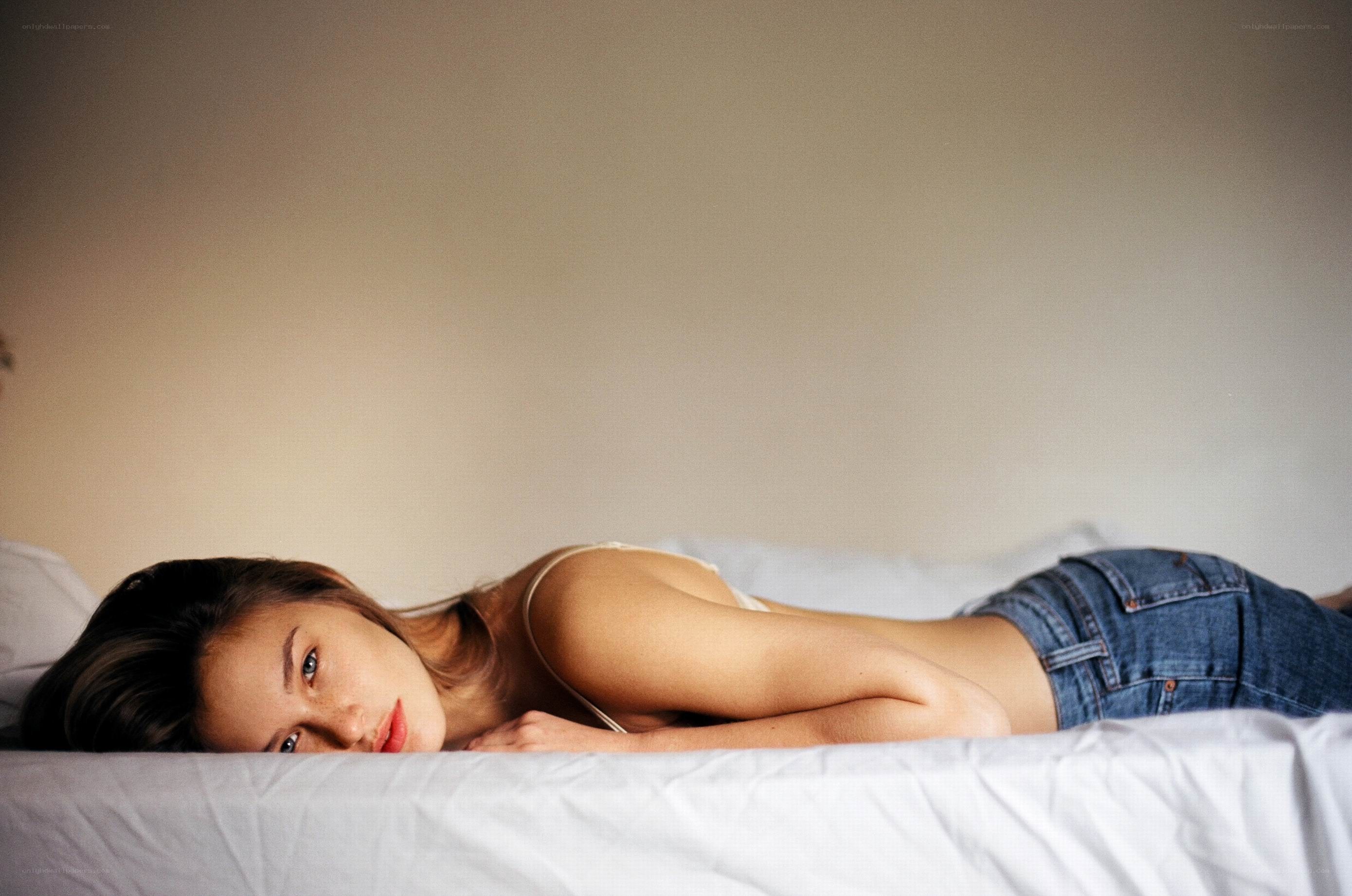 woman lying on a bed