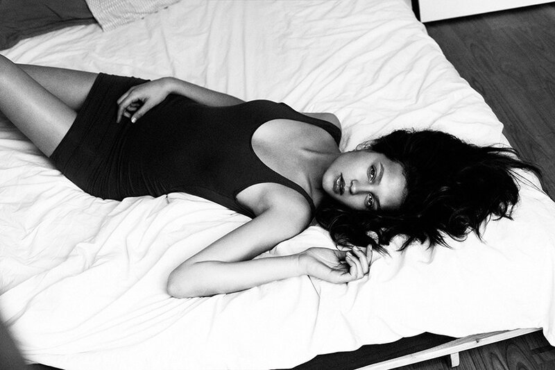 woman lying on a bed