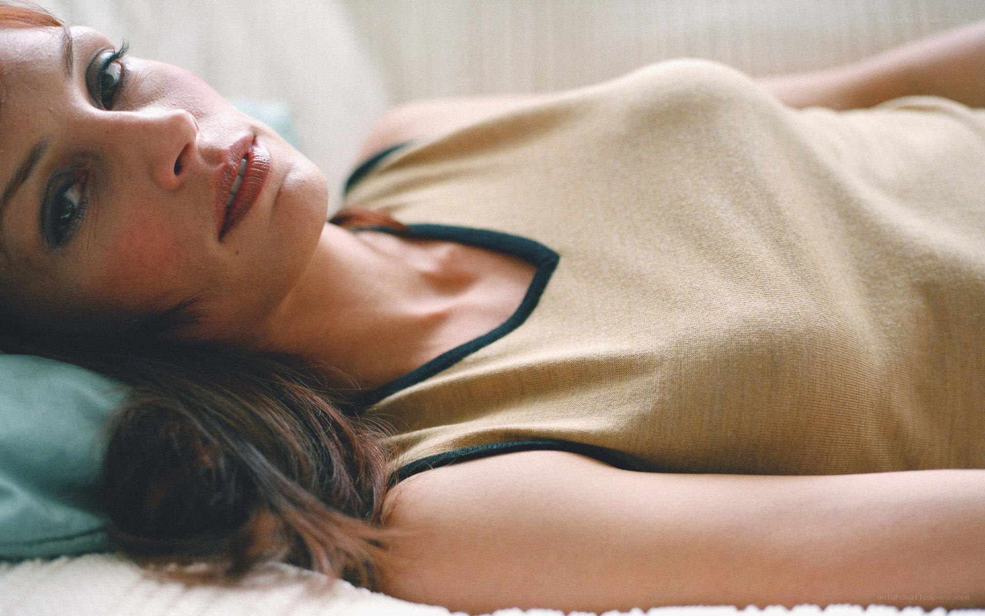 woman lying on a bed