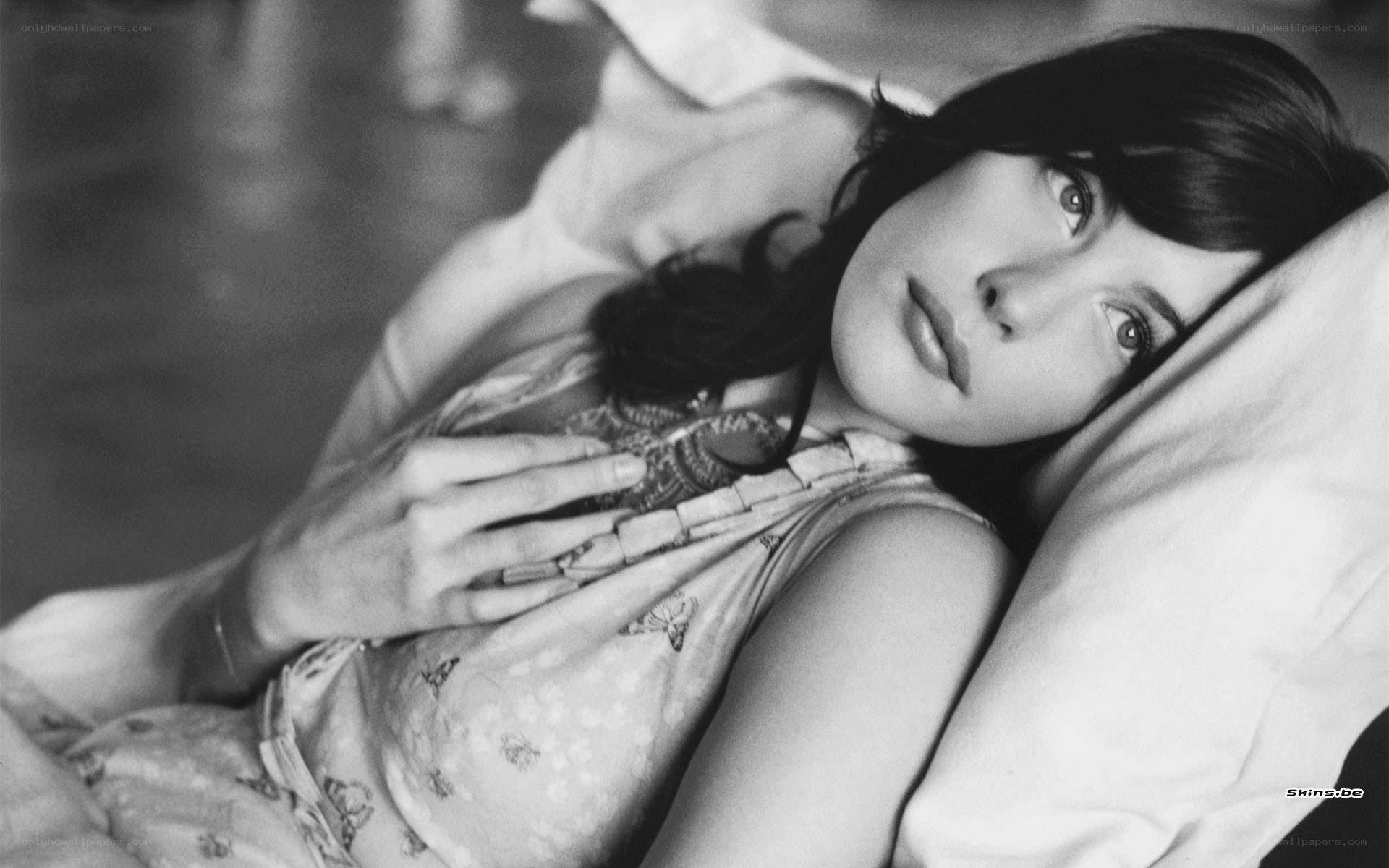 woman lying on a bed