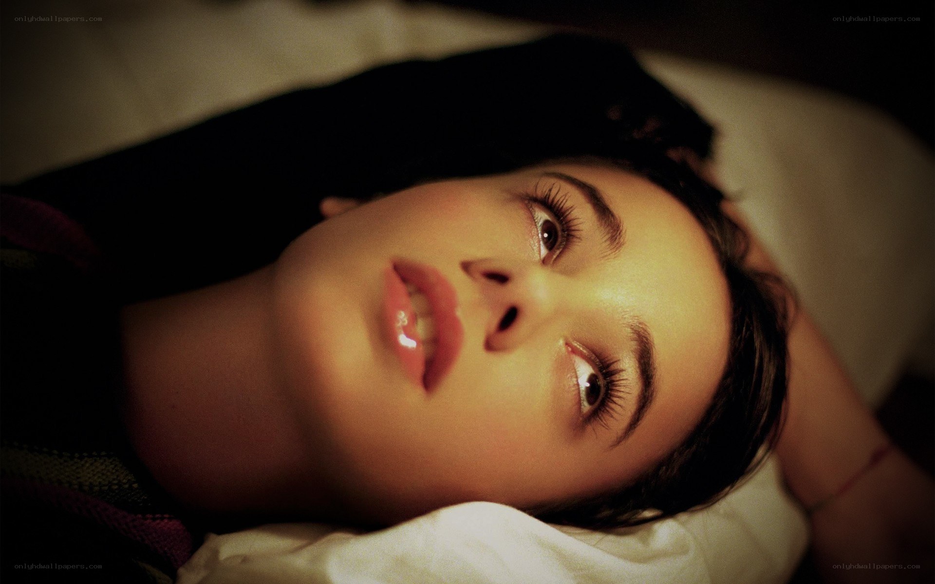 woman lying on a bed