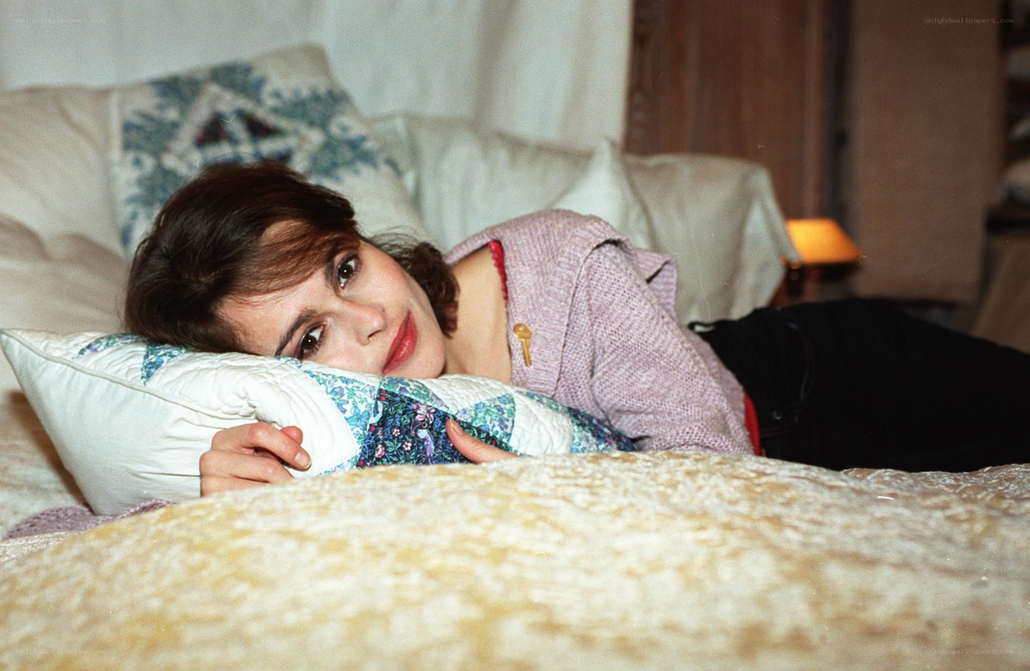 woman lying on a bed