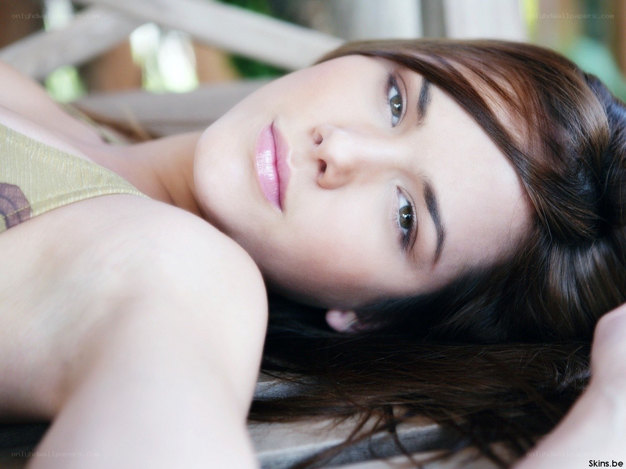 woman lying on a bench