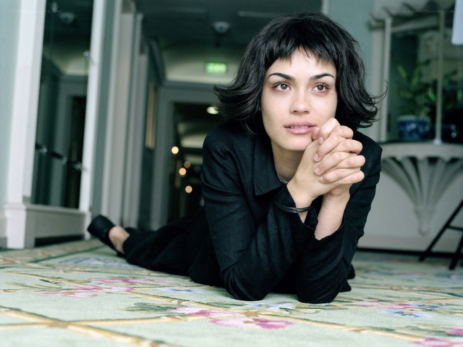 woman lying on a carpet