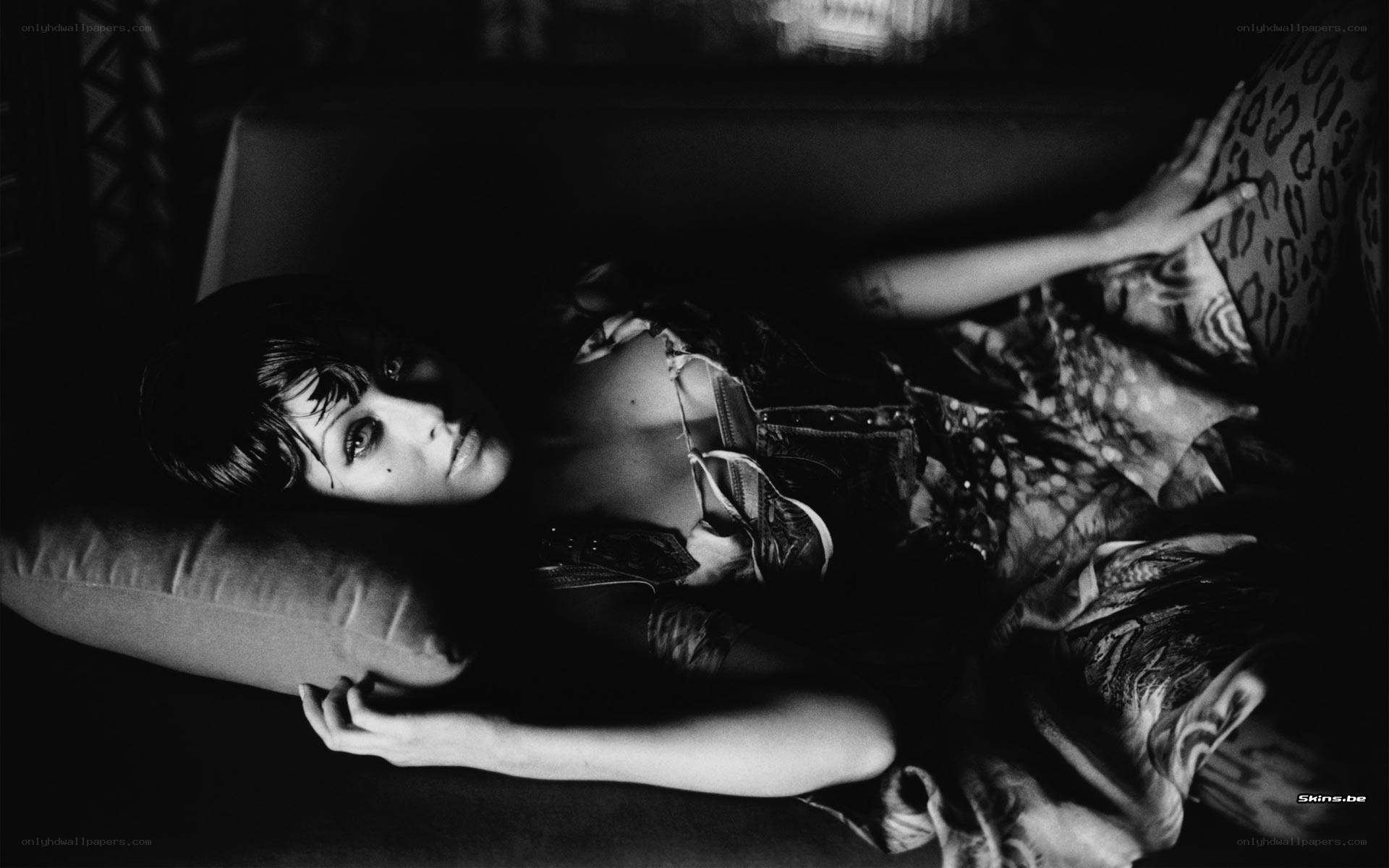 woman lying on a couch
