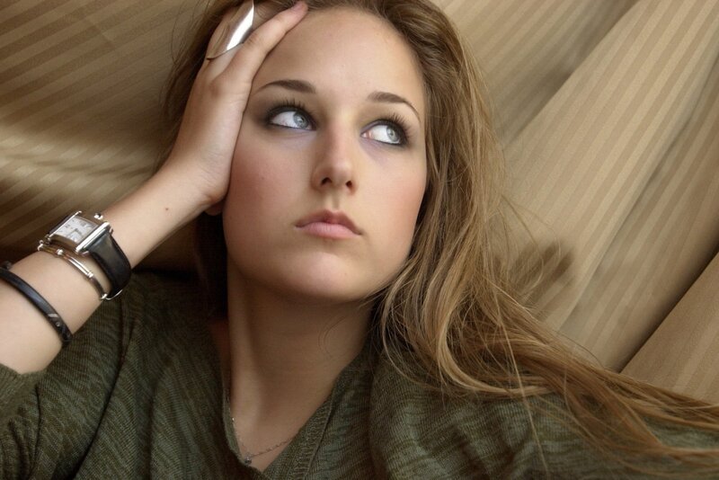 woman lying on a couch