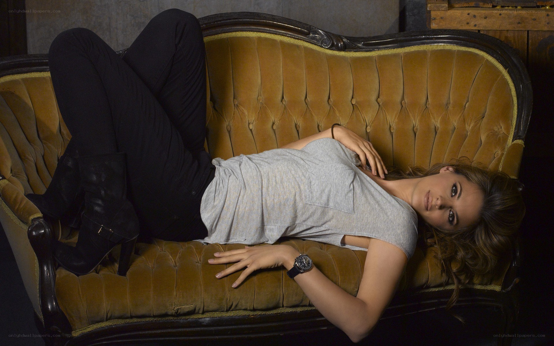 woman lying on a couch