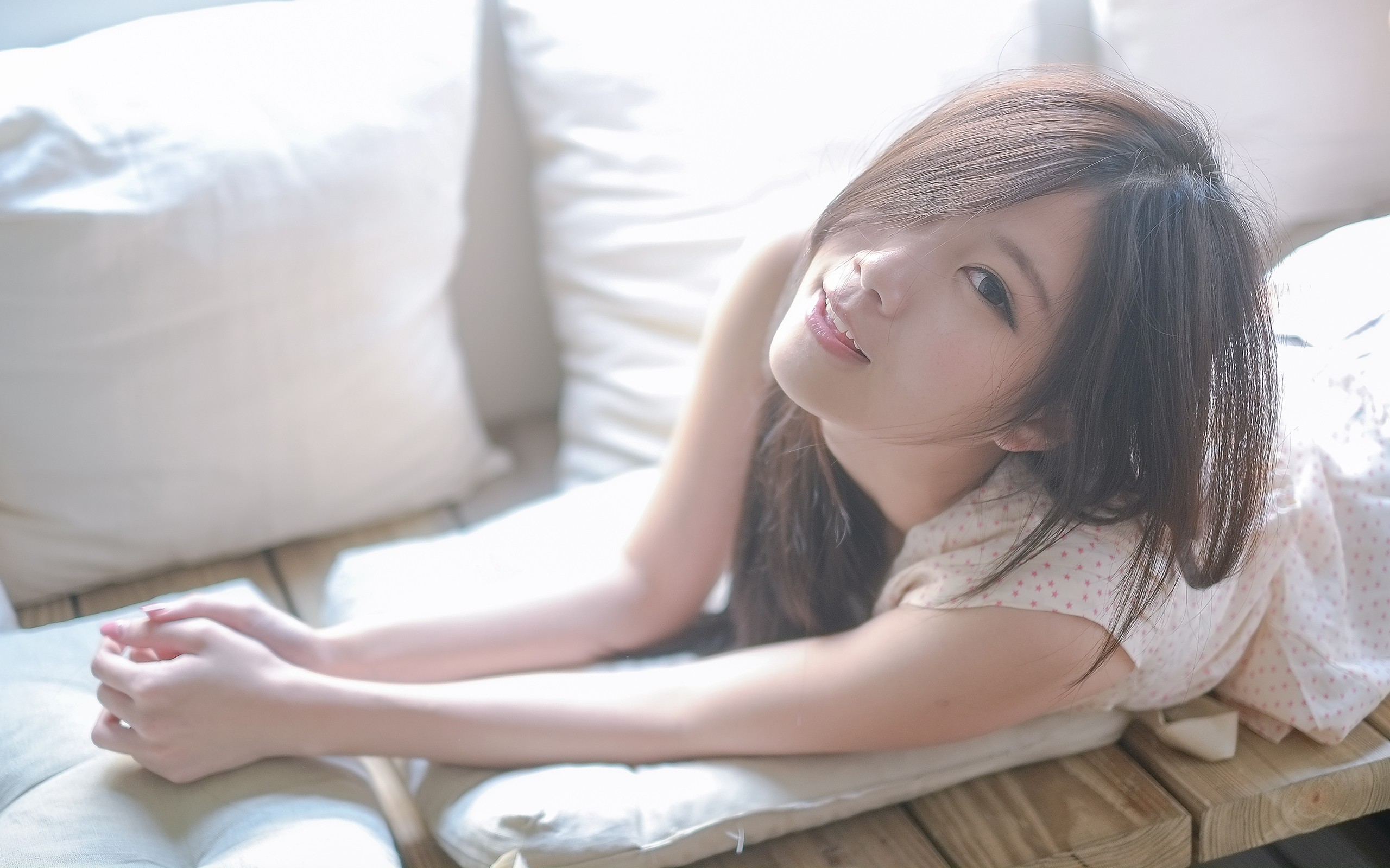 woman lying on a couch