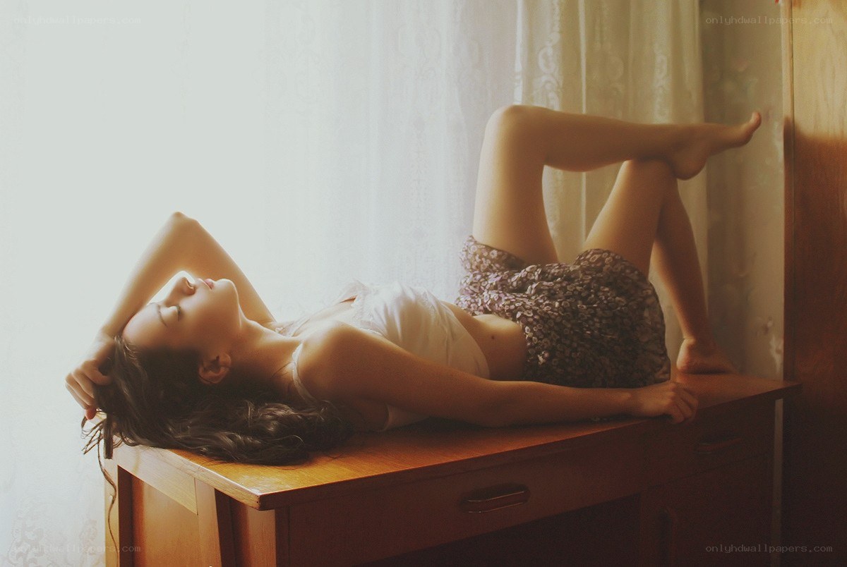woman lying on a desk