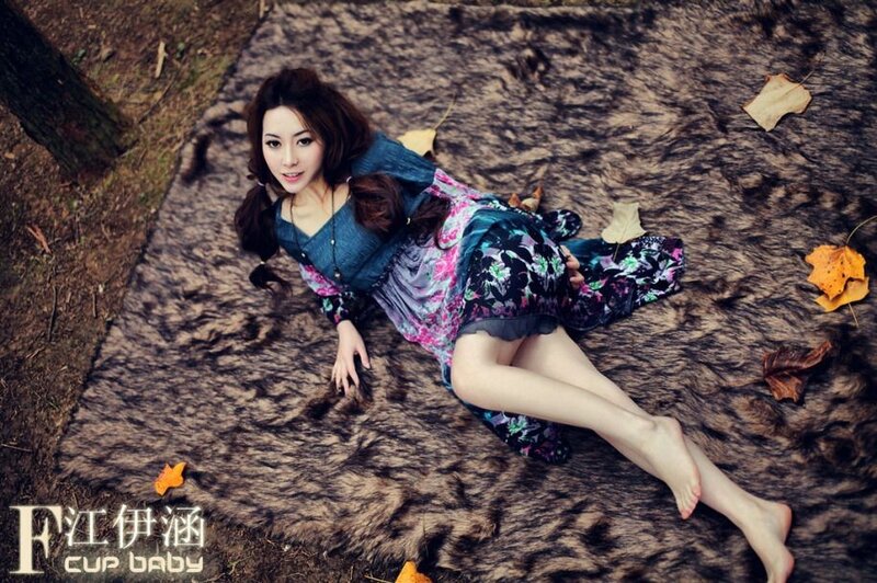 woman lying on a fur rug