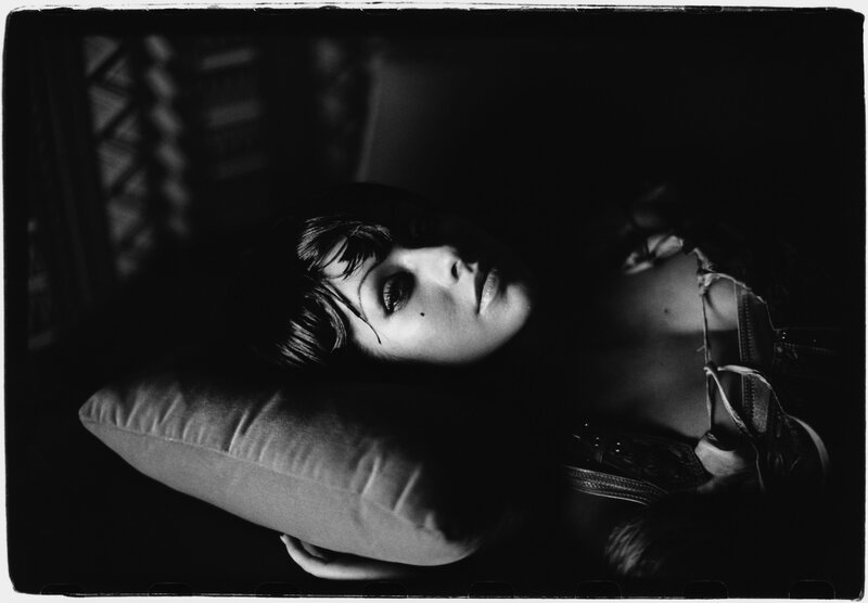 woman lying on a pillow